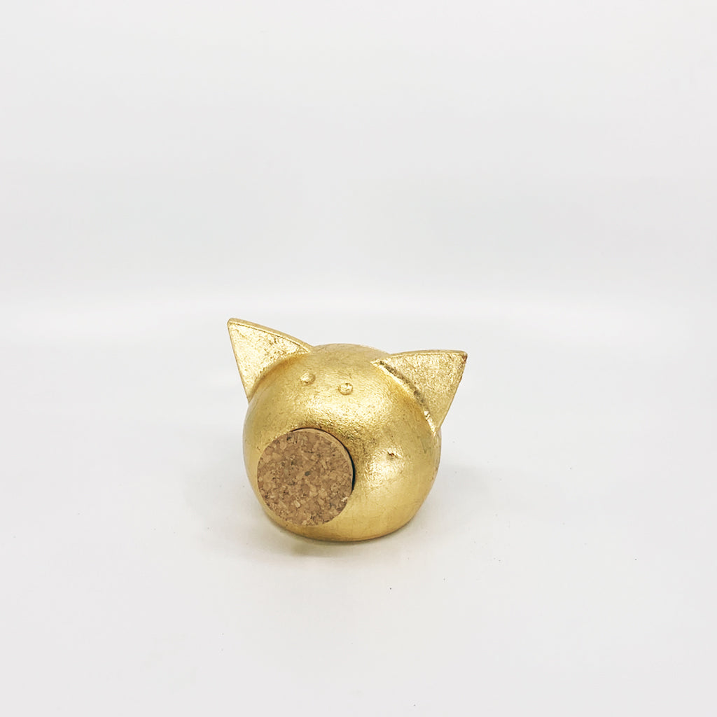 Golden piggy bank for decor & savings inspiration.